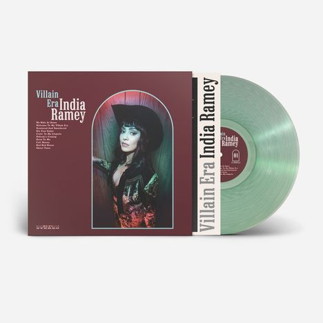 Text: "Villain Era India Ramey". Liste: 10 Songtitel. Foto: Frau mit Cowboyhut, bunte Jacke. Transparente, grüne Vinyl.