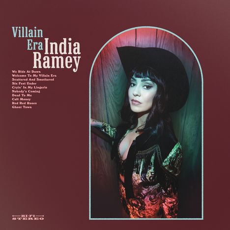 "Villain Era India Ramey" und Songtitel. Frau mit Cowboyhut in bunter Kleidung, schaut intensiv zur Seite.