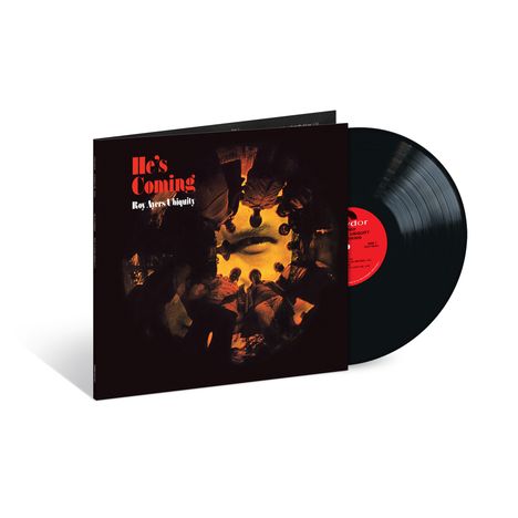 „He's Coming“ und „Roy Ayers Ubiquity“ sind in leuchtendem Rot auf einem Cover mit dunklen, warmen Farben zu sehen.