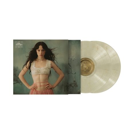 Text: "My Back Was a Bridge for You to Cross", "Tidal", "Hardback Book". Frau mit langem Haar, weißes Top, rosa Rock, zwei transparente Schallplatten.