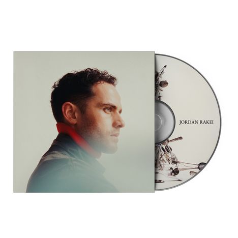 Text: "JORDAN RAKEI". 

Ein Mann im Profil, Schallplatte teilweise sichtbar.