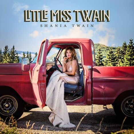 Text: "Little Miss Twain, Shania Twain". Eine Person sitzt in einem roten Pickup, umgeben von Natur, mit Bergen im Hintergrund.