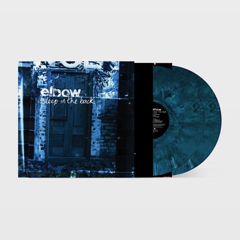 Text: „elbow sleep in the back“. Zwei blau marmorierte Schallplatten vor einem alten Holztor.