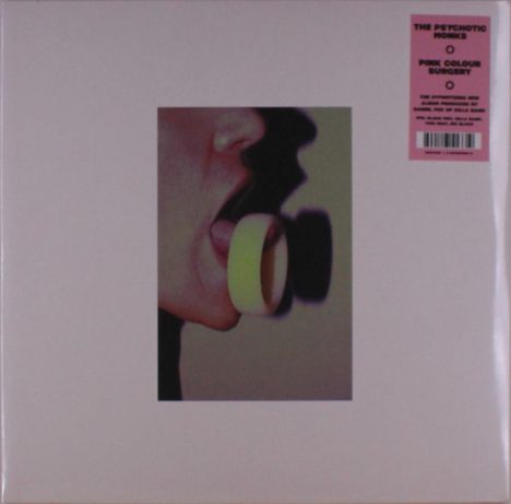"The Psychotic Monks, Pink Colour Surgery" steht auf rosa Etikett. Bild zeigt einen Mund, der eine gelbe Rolle hält.