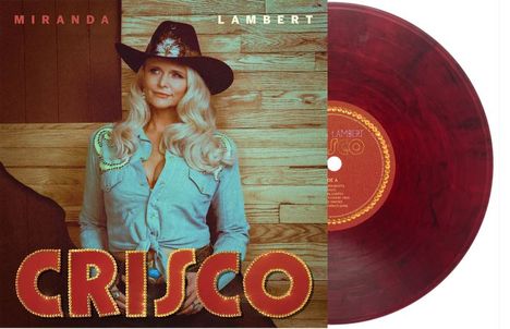 Texte: "MIRANDA LAMBERT", "CRISCO". Frau mit Cowboyhut, blauem Hemd vor Holzwand. Rote Vinyl-Schallplatte rechts daneben.