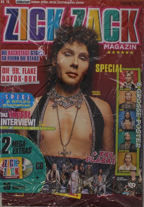 „ZICK ZACK MAGAZIN“ in bunten Buchstaben. „Die Dr. Flake Botox-Box“ oben links. Person mit lockigem Haar und Halskette.