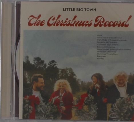 CD-Cover "The Christmas Record" von Little Big Town. Vier Menschen mit Kränzen auf einem Feld.