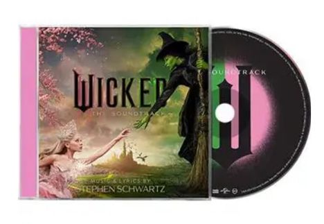 "WICKED the soundtrack", "music & lyrics by Stephen Schwartz." Eine Hexe mit grüner Haut und eine schöne Frau reichen sich die Hand.