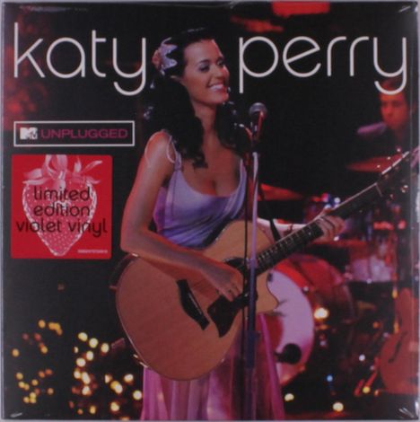 „katy perry“, „MTV UNPLUGGED“, „limited edition violet vinyl“. Eine lächelnde Frau mit Gitarre auf der Bühne.