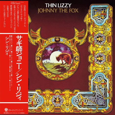 „THIN LIZZY JOHNNY THE FOX“ oben. Ein Stier in einer kreisförmigen Szene, umgeben von kunstvollem goldenen Dekor. Japanischer Text links.