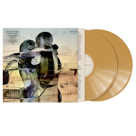 "Snow Patrol Eyes Open 20 Year Anniversary" links. Zwei goldene Schallplatten liegen rechts daneben. Abstrakte Kunst.