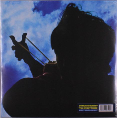 Texte: "SO MUCH COUNTRY", "'TIL WE GET THERE", "WESTSIDE COWBOY". Silhouette einer Person mit Schleuder vor blauem Himmel.