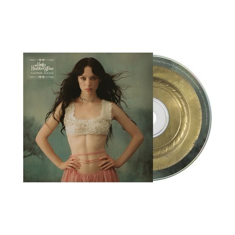 Text oben links: "Holly Humberstone, Cruel World - So It Ends". Frau mit dunklem Haar und bauchfreiem Top. CD daneben.