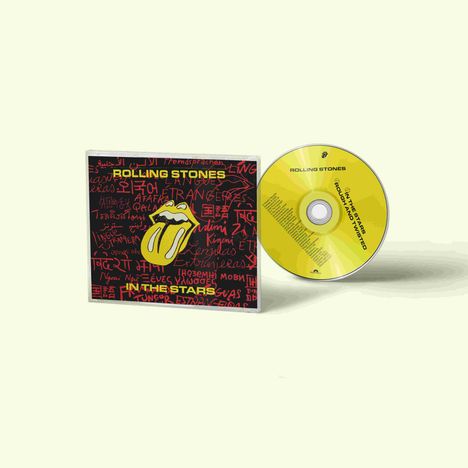 CD-Cover mit "ROLLING STONES", "IN THE STARS", Logo mit herausgestreckter Zunge. CD in Gelb daneben.