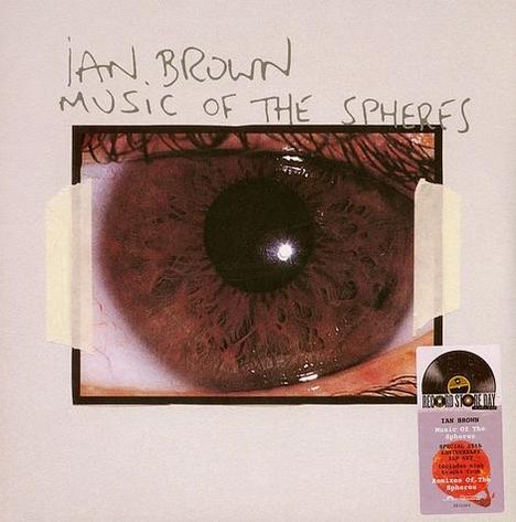 Oben steht "Ian Brown Music of the Spheres". Großes Nahaufnahme-Foto eines menschlichen Auges, darunter ein kleineres Logo.