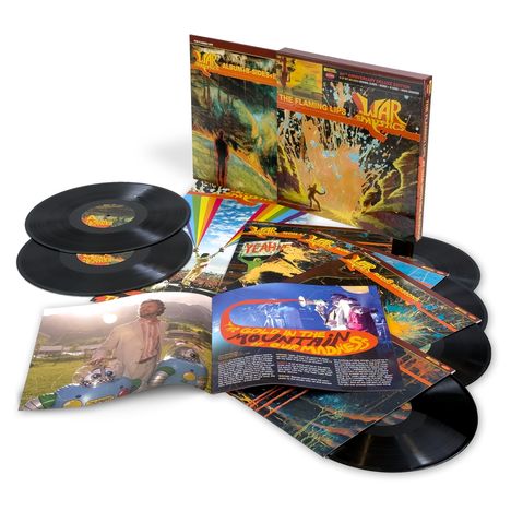 "The Flaming Lips," "Yeah," "The Gold in the Mountain of Our Madness." Cover zeigt bunte, surreale Kunst, Schallplatten.
