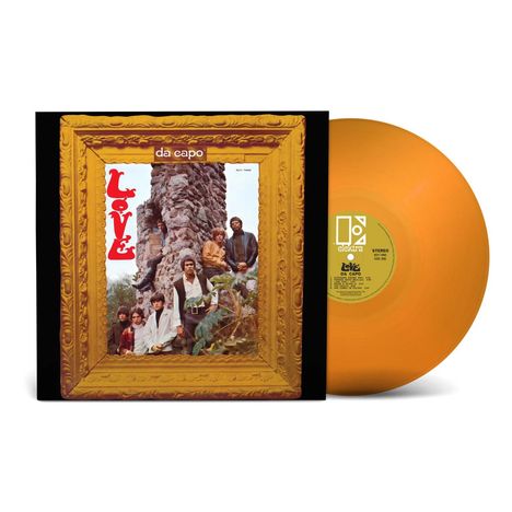 Text: "Love", "da capo". 
Ein quadratisches Albumcover mit vergoldetem Rahmen und eine orangefarbene Vinyl-Schallplatte.