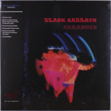 Texte: "BLACK SABBATH PARANOID". Verschwommene, bunte Gestalten vor dunklem Hintergrund in einer dynamischen Bewegung.