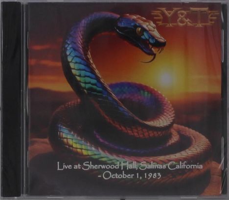 "Live at Sherwood Hall, Salinas California - October 1, 1983", bunte Schlange in einer dynamischen Pose vor Sonnenuntergang.