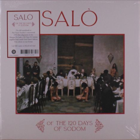 "Salò oder die 120 Tage von Sodom". Eine formelle Dinner-Szene in einem dunklen Raum, viele Gäste sitzen an einem langen Tisch.