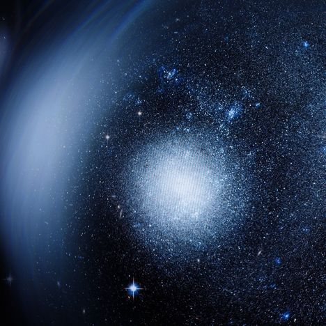 Ich erkenne keinen Text. Eine funkelnde Galaxie mit hellen Sternen in einem tiefblauen Weltraum.