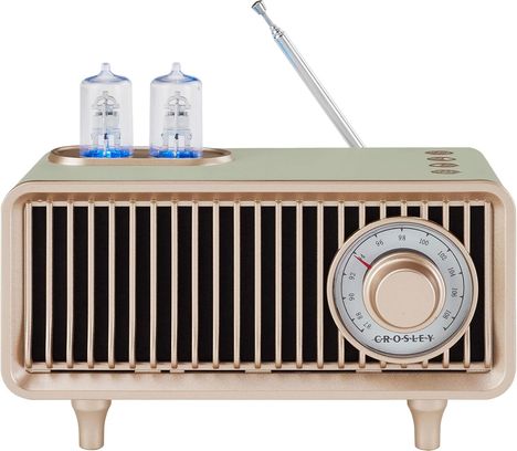 Ein Retro-Radio mit goldenen Beinen, zwei sichtbaren Röhren und einer kreisförmigen Skala mit rotem Zeiger.