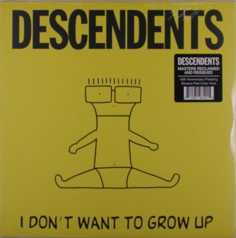 Text: DESCENDENTS, "I DON'T WANT TO GROW UP", "MASTERS RECLAIMED AND REISSUED". Gelbes Cover mit gezeichneter Figur.