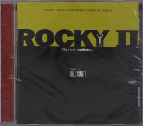 CD-Hülle mit gelbem und schwarzem Cover. Text: "ROCKY II", "The story continues...", Musik von Bill Conti.