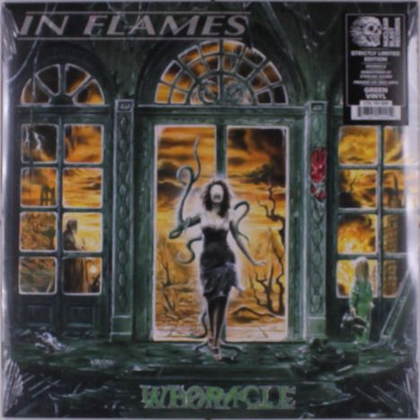 "IN FLAMES" oben, "WHORACLE" unten. Illustration: Frau mit Tentakeln in apokalyptischer Szene, brennender Hintergrund.