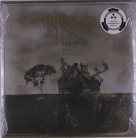 "Paradise Lost - At the Mill" steht auf einer dunklen, düsteren Landschaft mit einem alten Haus und Baum.