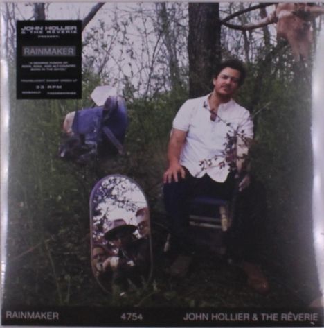 Text: "RAINMAKER", "JOHN HOLLIER & THE RÉVERIE", "4754". Ein Mann im Wald, sitzend, mit Spiegel.