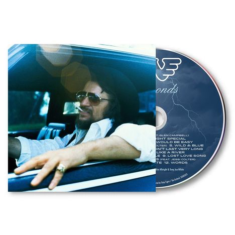 Texte: "Diamonds", "1. Midnight Special", "2. Just to Satisfy", "3. Would Be Easy"...  
Person am Autofenster mit Hut und Sonnenbrille. CD zeigt Blitze.