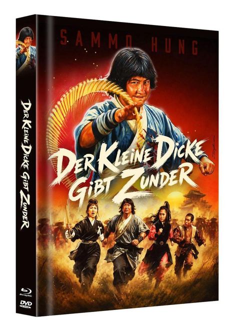 „Der Kleine Dicke Gibt Zunder“ steht in kräftigen Buchstaben. Ein Mann in Kampfpose dominiert, umgeben von Dynamik und Aktion.