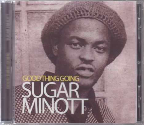 "GOOD THING GOING SUGAR MINOTT". Ein schwarz-weißes Porträt zeigt einen Mann mit Hut, der ruhig in die Kamera schaut.