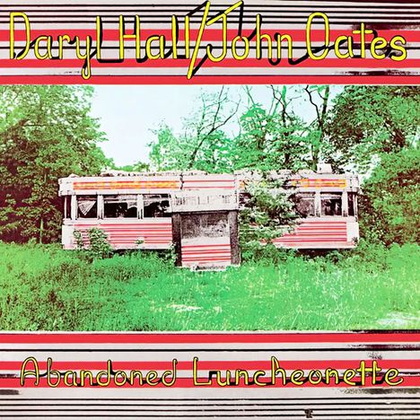 "Daryl Hall/John Oates" und "Abandoned Luncheonette" in gelber Schrift. Verlassener Imbisswagen in grüner Umgebung.