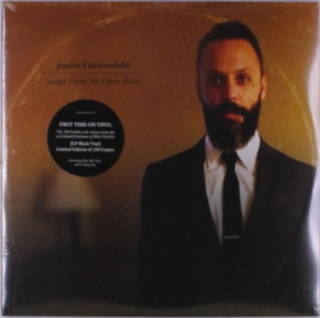 Texte: "Justin Furstenfeld", "Songs From An Open Book", "FIRST TIME ON VINYL". Ein Mann im Anzug mit Bart vor goldenem Hintergrund.