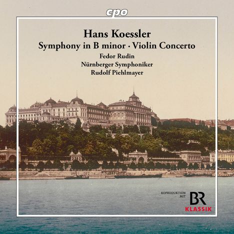 Text: "Hans Koessler Symphony in B minor · Violin Concerto Fedor Rudin Nürnberger Symphoniker Rudolf Piehlmayer." Im Hintergrund ist ein historisches Gebäude vor blauem Himmel und Wasser, mit grünem Bewuchs im Vordergrund.
