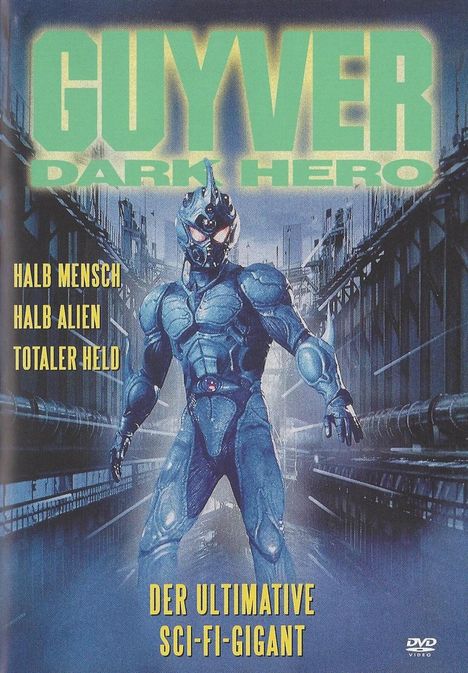 „GUYVER DARK HERO“, „HALB MENSCH, HALB ALIEN, TOTALER HELD“, „DER ULTIMATIVE SCI-FI-GIGANT“. Eine Figur in Rüstung.