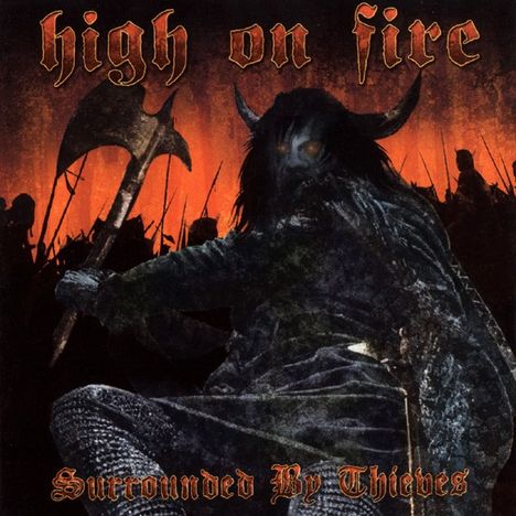 Oben: "high on fire", unten: "Surrounded By Thieves". Illustration eines dämonischen Wesens mit Axt vor feurigem Hintergrund.