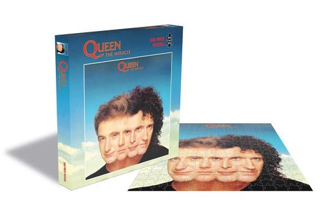 "QUEEN THE MIRACLE", 500 Teile Puzzle, zeigt vier verschmolzene Gesichter auf blauem Hintergrund. Verpackung sichtbar.