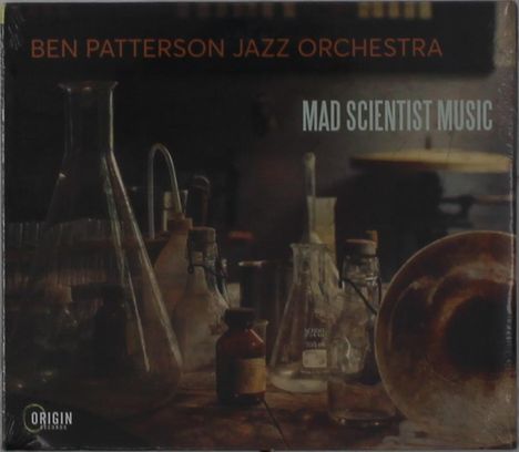 "Ben Patterson Jazz Orchestra" und "Mad Scientist Music" stehen auf einer Tischszene mit Laborflaschen und Gläsern im Hintergrund.