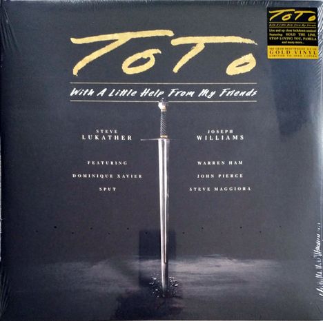 "TOTO" und "With A Little Help From My Friends" in großer Schrift, darunter Namen. Ein Schwert steht vertikal im Boden.