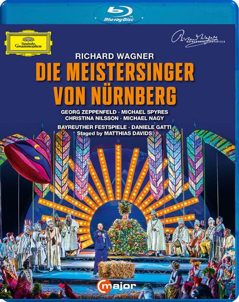 RICHARD WAGNER: DIE MEISTERSINGER VON NÜRNBERG. Szenenbild einer bunten Opernaufführung mit vielen Darstellern.