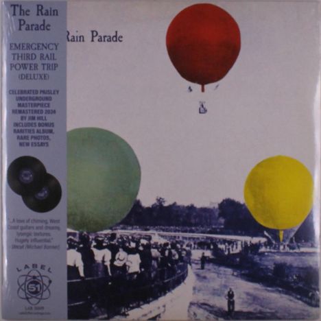Links oben steht "The Rain Parade". Darunter: "Emergency Third Rail Power Trip (Deluxe)". Drei bunte Heißluftballons.