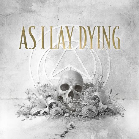 "As I Lay Dying" in goldener Schrift, darunter ein Totenkopf mit Blumen, auf einem verwittert wirkenden Hintergrund.