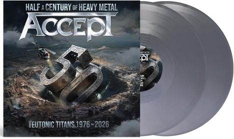 "HALF A CENTURY OF HEAVY METAL" und "TEUTONIC TITANS 1976–2026". Großes 3D-"50" in apokalyptischer Landschaft. Zwei graue Vinylplatten.