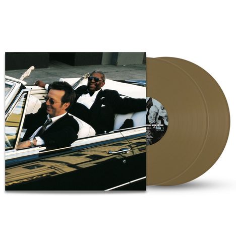 Auf dem Cover sind zwei lächelnde Männer in einem offenen Auto. Im Hintergrund sind Vinyl-Schallplatten zu sehen.