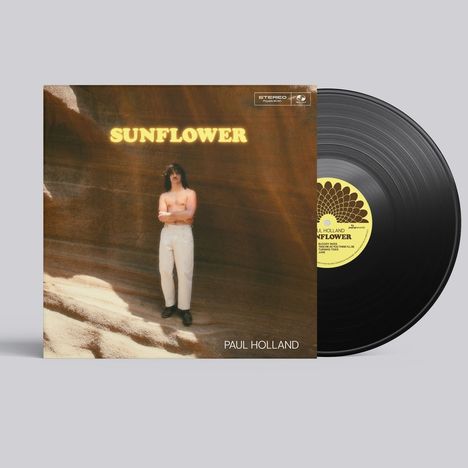 "Sunflower" oben, "Paul Holland" unten. Detailreiches Albumcover zeigt Person in weißer Hose vor sandiger Felswand.