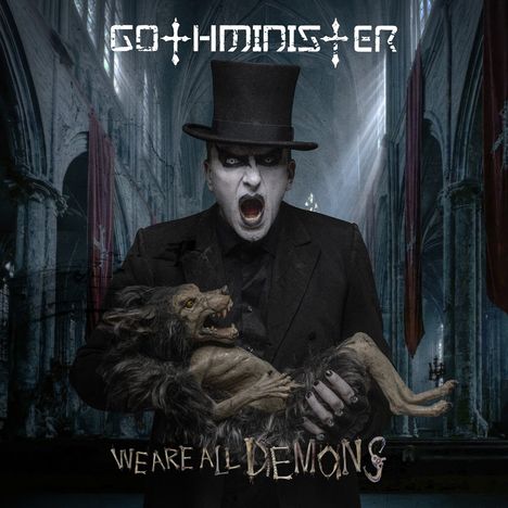 Text: "Gothminister", "We Are All Demons". Ein Mann im Frack mit Zylinder hält ein dämonisches Wesen in einer gotischen Kathedrale.