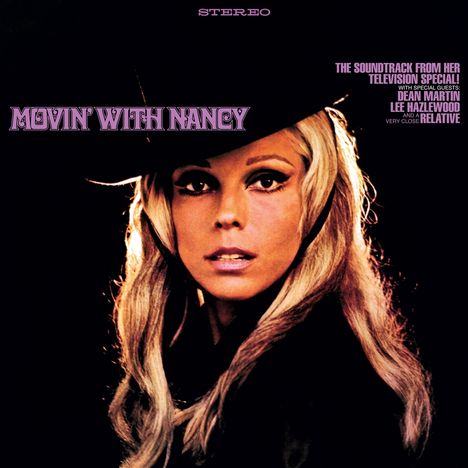 "Movin' With Nancy" steht im Vordergrund, darüber der Text "STEREO". Eine Frau mit langen blonden Haaren trägt einen schwarzen Hut.